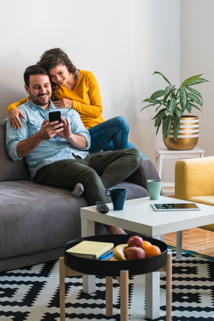 Happy couple looking at a phone