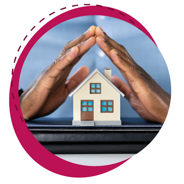 Pair of hands protecting a model house symbolizing protection